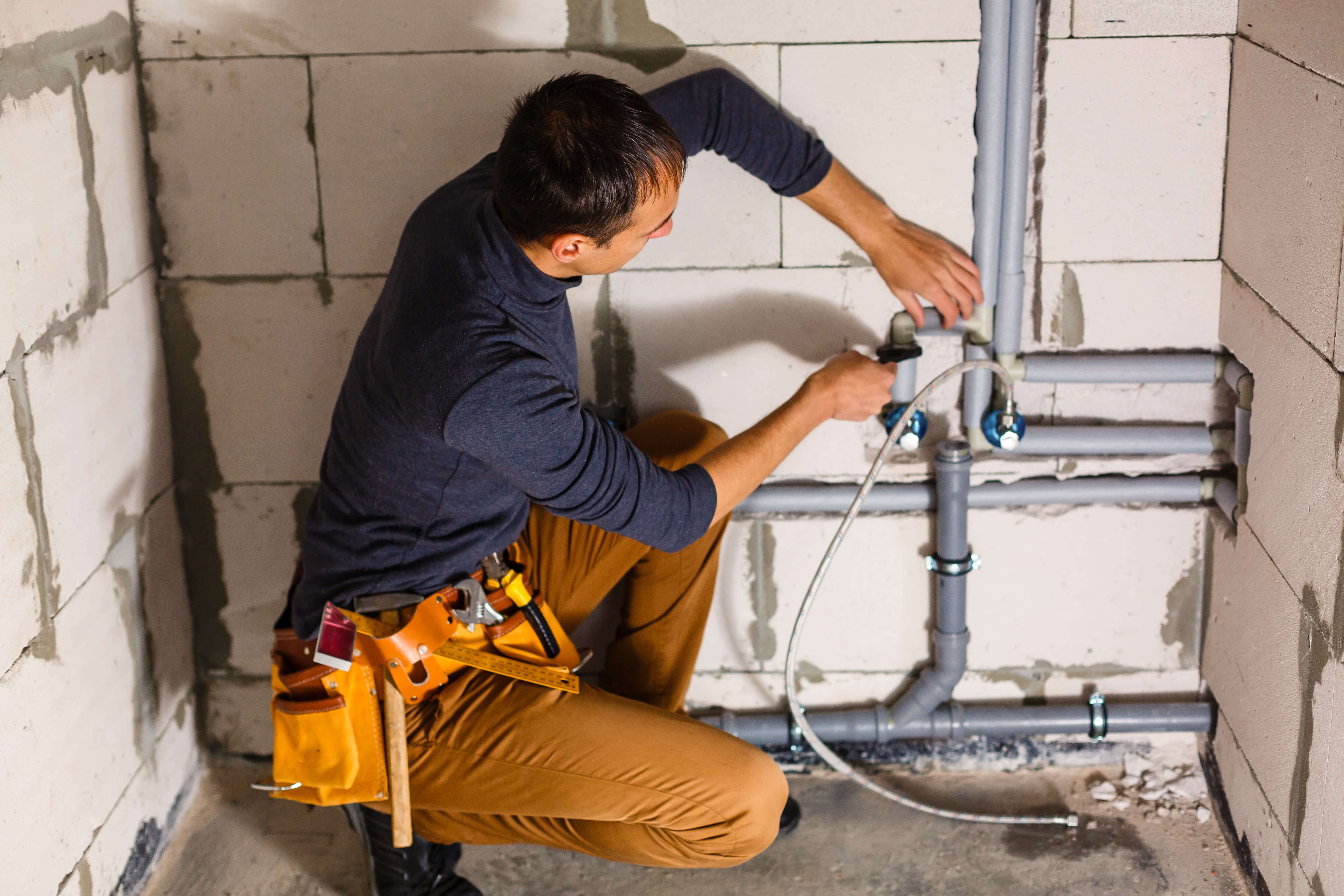 Plumber fixing a boiler in clapham